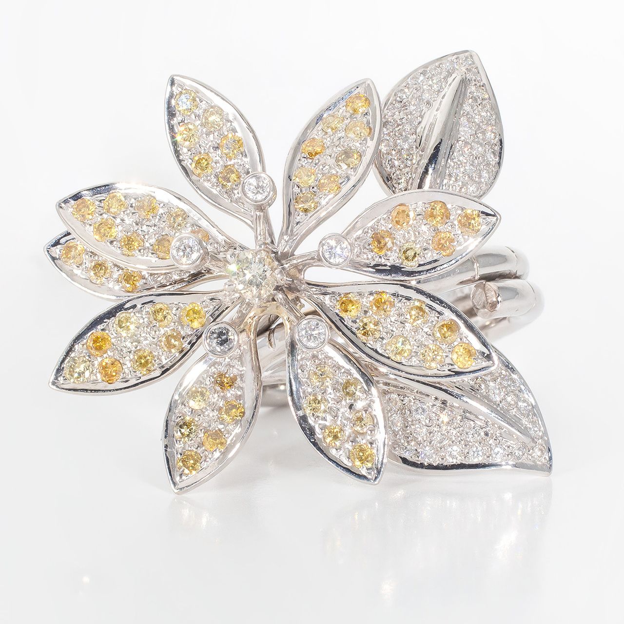 Folded style flower ring with bezel and pave set round diamonds.  D1.56ct.t.w.