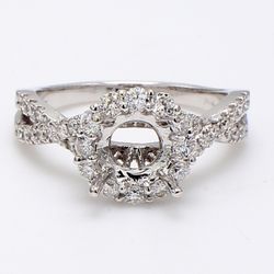 Halo split-shank semi-mount with 4-prong set round diamonds.  D0.72ct.t.w.