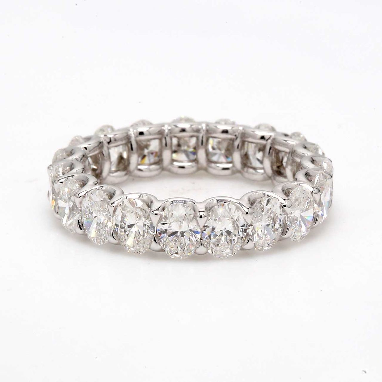 Eternity band in platinum with shared U-prong set oval diamonds.  D3.58ct.t.w.