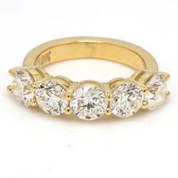 5-stone band in 18K YG with basket prong set round diamonds.  D3.51ct.t.w.  Size 6.25
