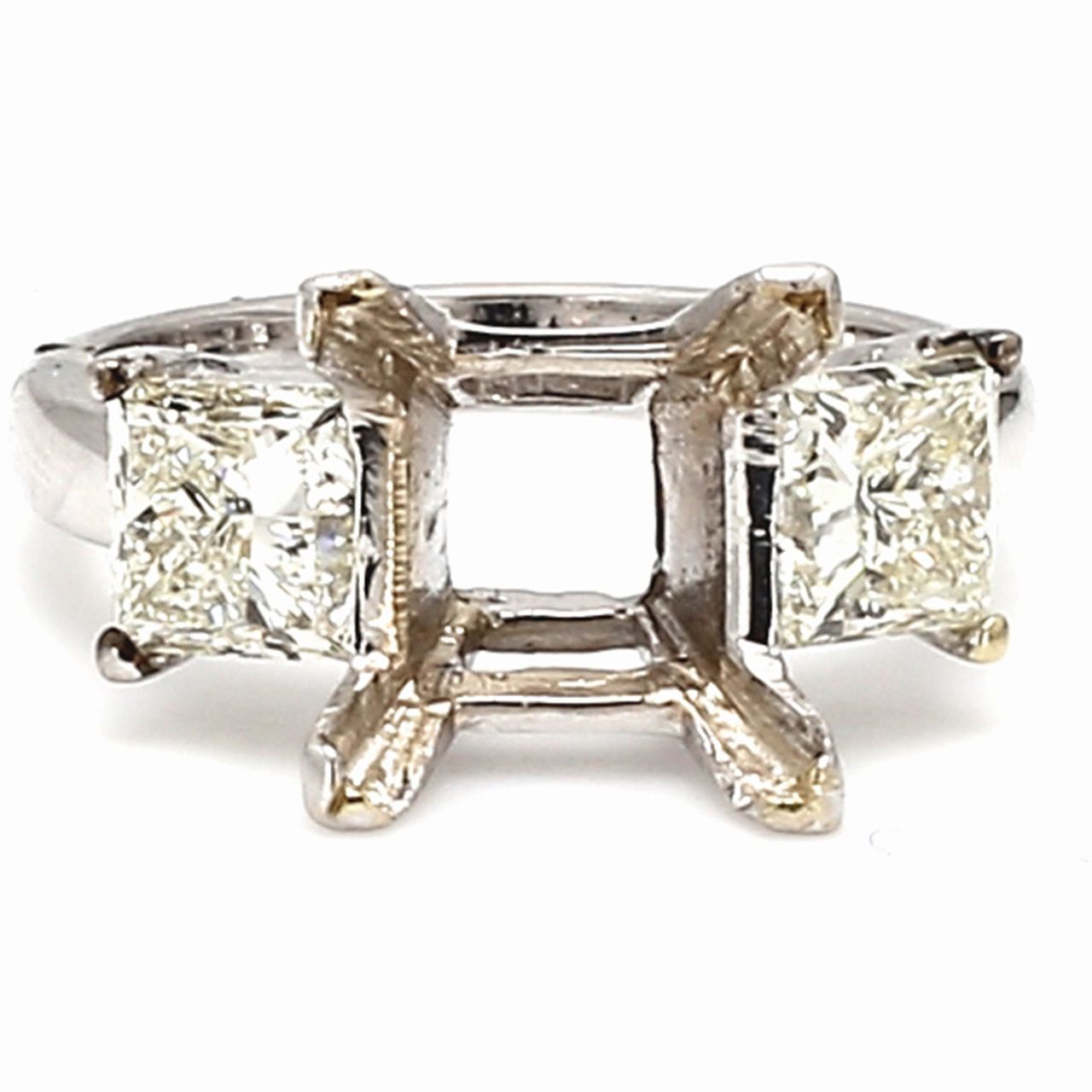 3-stone semi-mount in 18K WG w/ prong set princess cut diamond side stones.  D2.01ct.t.w.
