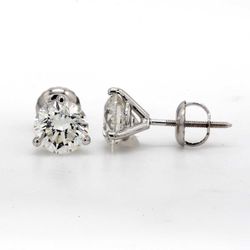 Screw back martini style stud earrings with 3-prong set round diamonds.  D0.38ct.t.w.