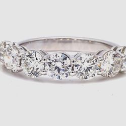7-stone band in platinum with basket prong set round diamonds.  D2.11ct.t.w.  Size 5.5