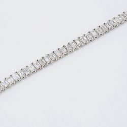 7' Tennis bracelet in platinum with F/VS prong set emerald cut diamonds.  D11.03ct.t.w.