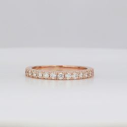 Band in 14K RG with half-way shared prong set round diamonds.  D0.37ct.t.w.  Size 5