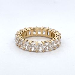 Eternity band in 18K YG with open basket prong set (21) radiant cut diamonds.  D5.46ct.t.w.  Size 6