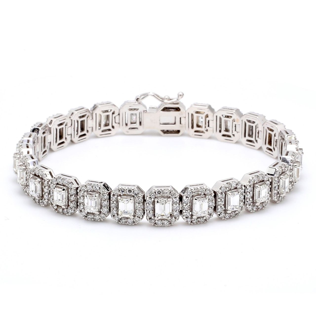 7' Designer halo bracelet in 18K WG with shared prong set rounds & 4-prong set emerald cut diamonds.  D9.26ct.t.w.