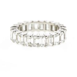 Eternity band in 18K WG with shared prong set (22) Emerald cut diamonds.  D6.65ct.t.w.  Size 6.75
