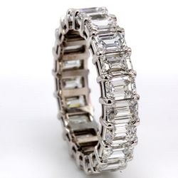 Eternity band in platinum with basket prong set (21) emerald cut diamonds.  D6.00ct.t.w.  Size 8