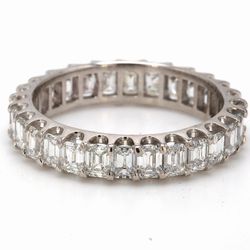 Eternity band in platinum with U-prong set (28) emerald cut diamonds.  D3.14ct.t.w.  Size 7