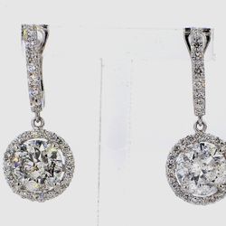 Halo dangling earring with pre-set rounds around USA certified D-E/I1 round diamonds.  D4.08ct.t.w.