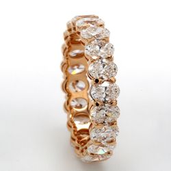 Eternity band in 18K RG with shared U-prong set (20) oval diamonds.  D3.50ct.t.w.