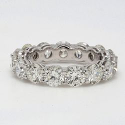 Eternity band in platinum with shared prong set round diamonds.  D5.11ct.t.w.  Size 5.75