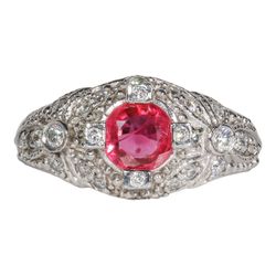 Antique style ring in platinum with round diamonds & round shaped Ruby center.  D0.37ct.t.w.  Ruby 1.06ct