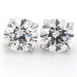 Push back stud earrings with basket prong set round diamonds.  D3.00ct.t.w.
