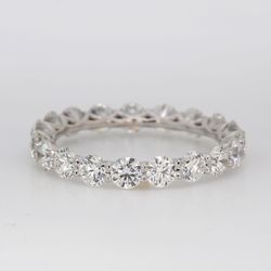 Eternity band in platinum with shared U-prong set round diamonds.  D2.30ct.t.w.  Size 6