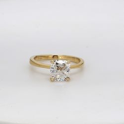 Solitaire ring in yellow gold w/ GIA certified E/SI1 cushion cut center stone.  D1.92ct.t.w.