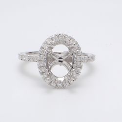 Halo semi-mount with shared prong set round diamonds.  D0.52ct.t.w.  Size 4.75