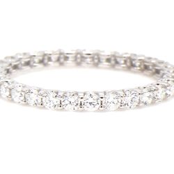 Eternity band with U-prong set round diamonds.  D0.85ct.t.w.  Size 6