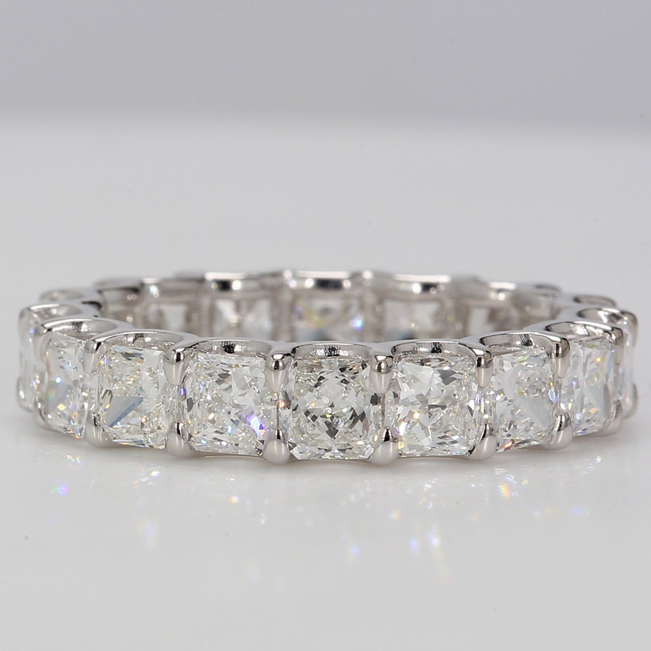 Eternity band in Platinum with U-prong set F+/VS+ (18) square radiant diamonds.  D4.46ct.t.w.  Size 6.75