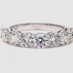 7-stone band in platinum with basket prong set round diamonds.  D1.65ct.t.w.  Size 4.75