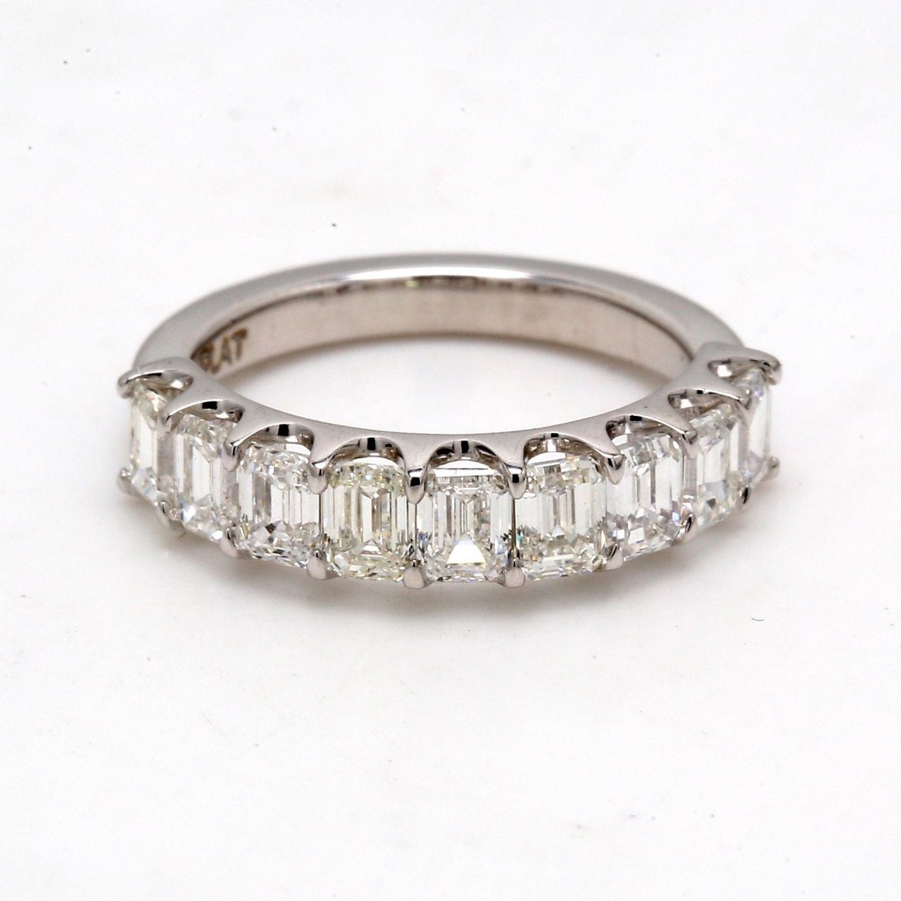 9-stone band in platinum with U-prong set emerald cut diamonds.  D1.79ct.t.w.  Size 4.5
