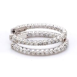 1.25' Inside out hoop earrings with shared prong set round diamonds.  D1.92ct.t.w.
