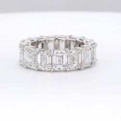 Eternity band in platinum with double basket shared prong set GIA certified D-F/IF-VVS2 (15) emerald cut diamonds.  D10.58ct.t.w.  Size 5