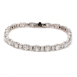 7' Tennis bracelet in 18K WG with prong set round and oval diamonds.  D10.08ct.t.w.