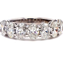 7-stone band in platinum with basket prong set oval cut diamonds.  D2.17ct.t.w.  Size 6