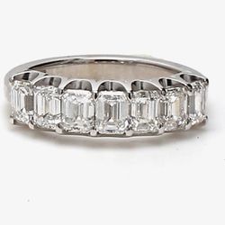 7-stone band in platinum with U-prong set emerald cut diamonds.  D1.69ct.t.w.  Size 4.75
