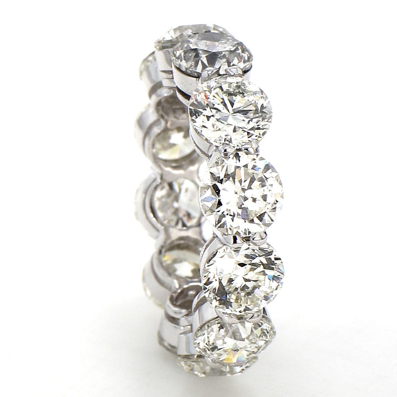 Eternity band in platinum with basket prong set (12) round diamonds.  D12.02ct.t.w.  Size 7.25
