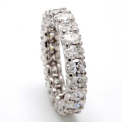 Eternity band in platinum shared U-prong set (22) oval diamonds.  D3.11ct.t.w.  Size 5