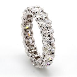 Eternity band in platinum with shared U-prong set (18) oval cut diamonds.  D5.49ct.t.w.  Size 7