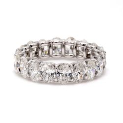 Eternity band in platinum with shared U-prong set E-F/VS1-VS2 oval diamonds.  D3.81ct.t.w.
