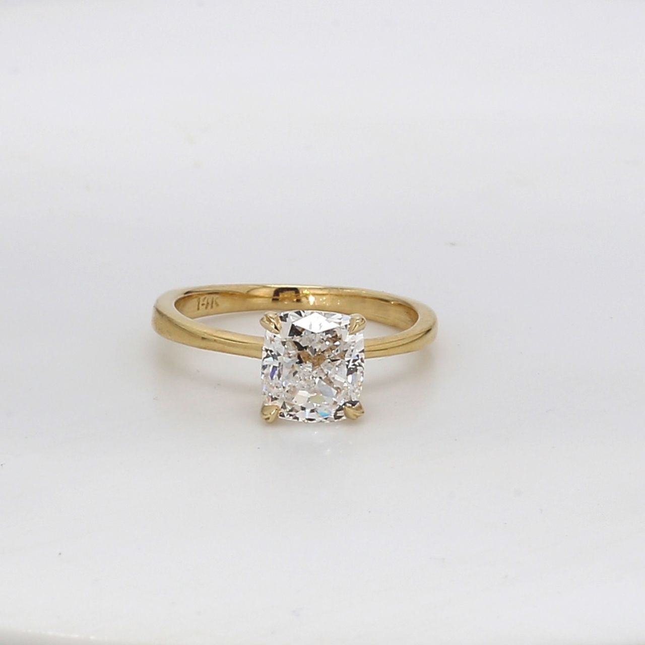 Solitaire ring in yellow gold w/ GIA certified E/SI1 cushion cut center stone.  D1.92ct.t.w.