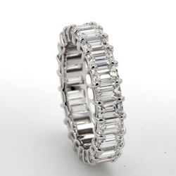Eternity band in 18K WG with prong basket set (24) emerald cut diamonds.  D3.50ct.t.w.  Size 5