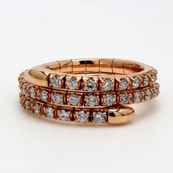 Flexible eternity tri-band style in 18K gold with pre-set round diamonds.  D1.07ct.t.w.