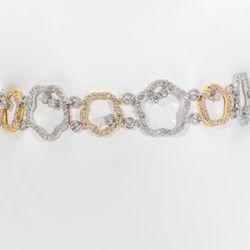 Star shaped link bracelet in 18K two-tone with prong set round diamonds.  D2.77ct.t.w.