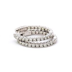 1' Oval shaped inside out hoop earrings with 4-prong set round diamonds.  D2.03ct.t.w.
