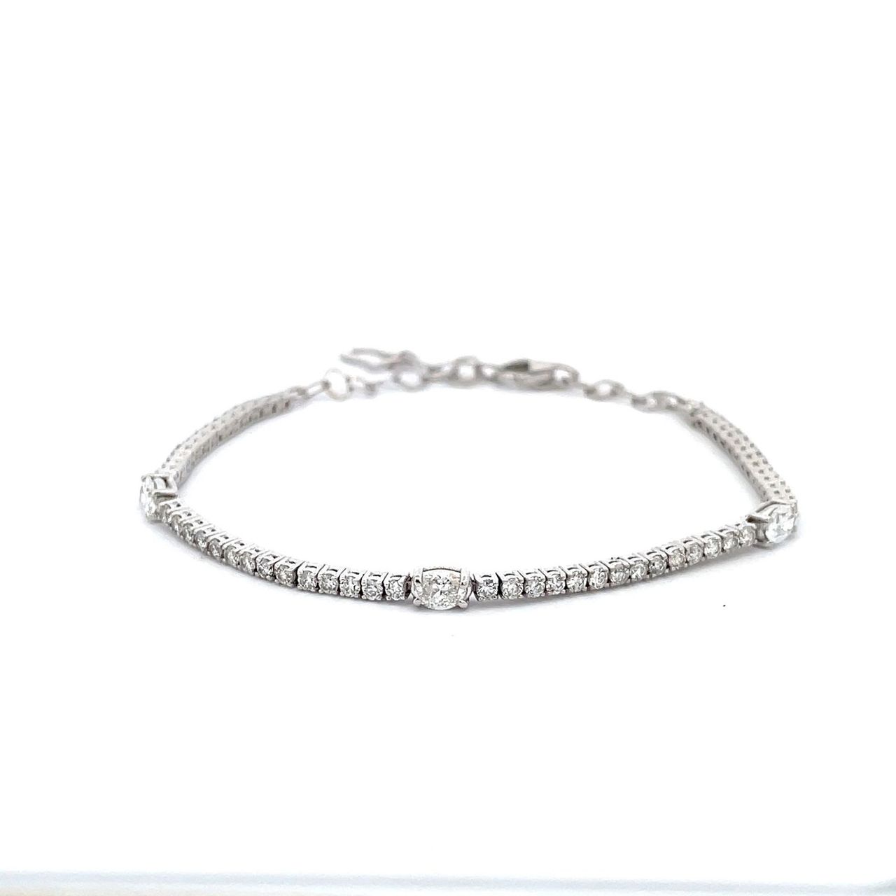Adjustable bracelet with prong set round and oval diamonds.  D1.76ct.t.w.