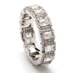 Halo eternity band with pave set round diamond around 4-prong set (14) emerald cut diamonds.  D3.56ct.t.w.  Size 8