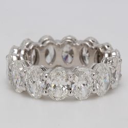 Eternity band in platinum with shared prong basket set GIA certified D-F/SI1 (14) oval diamonds.  D7.04ct.t.w.  Size 5