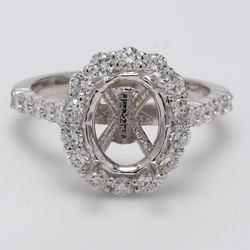 Halo semi-mount with shared prong set round diamonds.  D0.99ct.t.w.