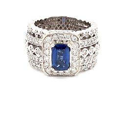 Multi row wide band in 18K WG with pave set round diamonds and 4-prong set cushion shape Sapphire center.  D1.75ct.t.w.  (Sapphite - 1.38ct.)