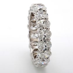 Eternity band in platinum with basket set (18) oval diamonds.  D4.38ct.t.w.  Size 5.75