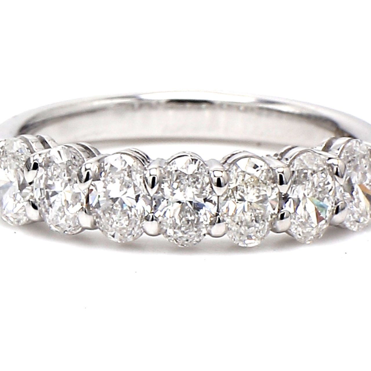7-stone band in platinum with basket prong set oval cut diamonds.  D1.30ct.t.w.  Size 7
