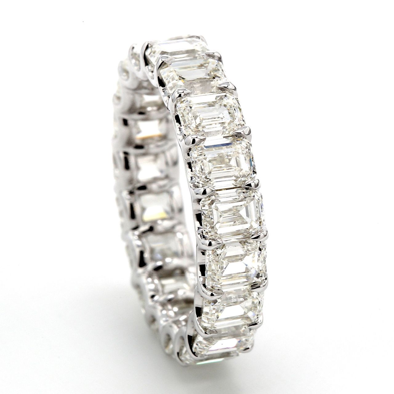 Eternity band in 18K WG with shared claw U-prong set (19) emerald cut diamonds.  D5.72ct.t.w.  Size 5