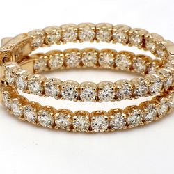 1.25' Oval shape inside out hoop earrings in yellow gold with prong set (44) round diamonds.  D4.75ct.t.w.