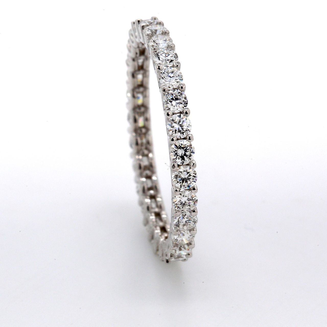 Eternity band with shared U-prong set (29) round diamonds.  D1.00ct.t.w.